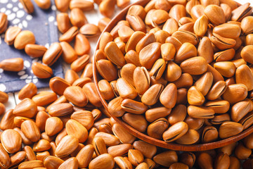 Pine nuts on a white board