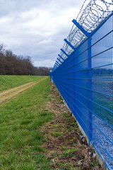 Prison barbed wire. Prison fence. Strict punishment for crimes