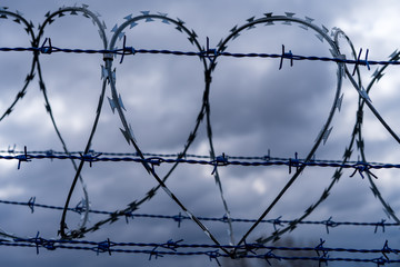Prison barbed wire. Prison fence. Strict punishment for crimes
