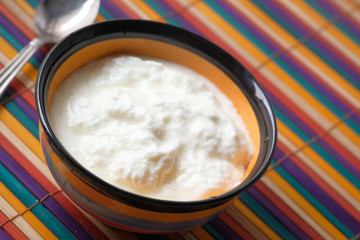 Close up of greek yogurt in a bowl on table 