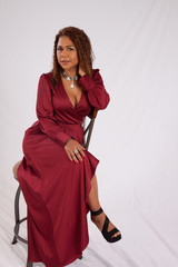Naklejka premium Woman in red dress pondering
