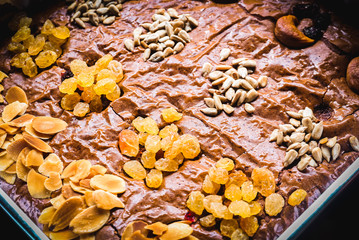 Homemade Brownies dark chocolate with topping Almond Cashew nut Currants  overlay style
