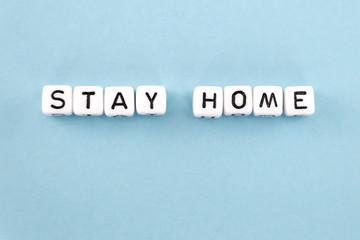 Fototapeta na wymiar stay at home phrase composed with cubes