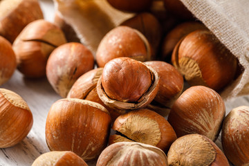 Hazelnut nuts on a white board