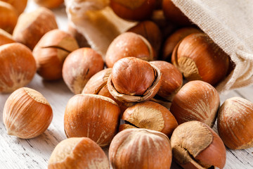 Hazelnut nuts on a white board