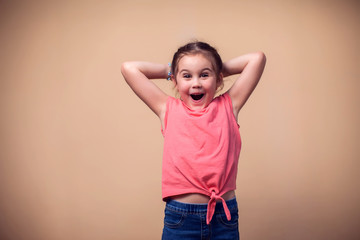 A portrait of happy kid girl. Children and emotions concept