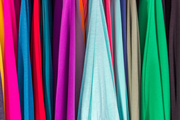 Bright color juicy fabrics of different shades. Light airy matter. Bright background.