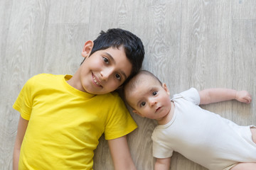 Fototapeta premium Newborn baby with brother. Brothers. Summer time. Friends. love and friendship.