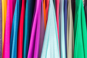 Bright color juicy fabrics of different shades. Light airy matter. Bright background.