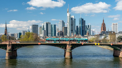 Obraz premium Frankfurt, Germany - March 31, 2020: frankfurt skyline view with ignas bubis bridge during daytime