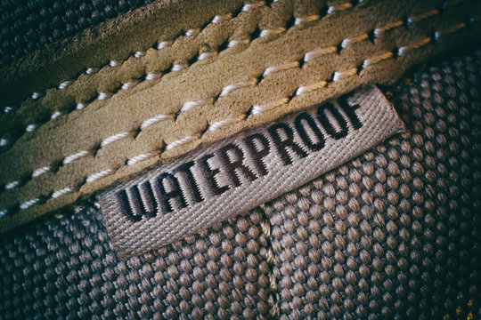 Waterproof label on hiking mountain shoes, close-up view