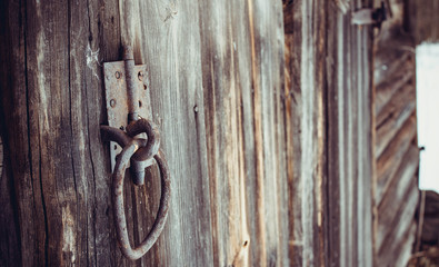 Old catch and old door hinge on a vintage shed.