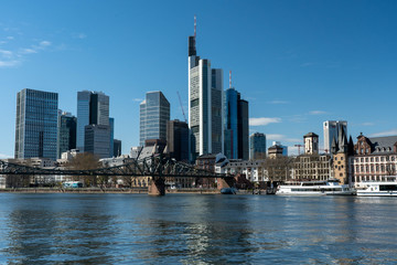 Fototapeta na wymiar Frankfurt, Germany - March 31, 2020: frankfurt skyline view from main riverside in springtime