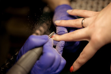 Obraz na płótnie Canvas Women do manicures at home. Self-isolation manicure. Nail salon
