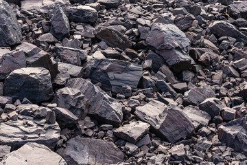 Background of stones near iron ore quarry