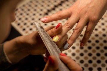 Women do manicures at home. Self-isolation manicure. Nail salon