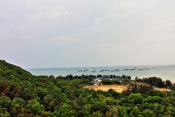 Fototapeta na wymiar Seascape with ships on Sanya Island in China.