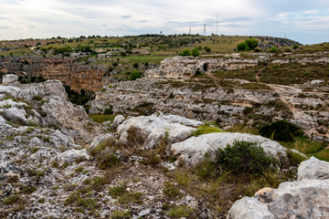 Parco della Murgia Materana or Park of the Rupestrian Churches of Matera with ancient architecture. Matera canyon panoramic view in the Province of Matera, Basilicata Region, Italy