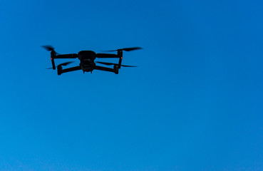 here comes a black drone approaching 
