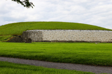The dazzling white quartz stone façade of Newgrange megalithic passage tomb in the Boyne Valley...