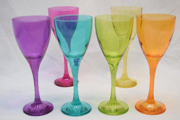 Mock up design set of elegant and traditional drink ware / drinking glass & Jar for wine or juice, colorful transparent isolated on black background 