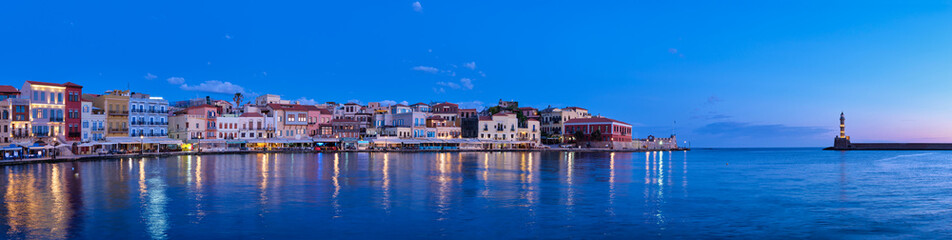 Fototapeta na wymiar Panorama of picturesque old port of Chania is one of landmarks and tourist destinations of Crete island in the morning on sunrise. Chania, Crete, Greece