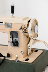 Sewing machine details close-up in pastel light colors sewing courses
