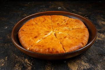 khachapuri with cheese on black background