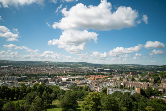 Aerial view of Bristol skyline, a green city in UK with a blue summer sky