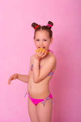 Little girl with lemon. Vitamin C