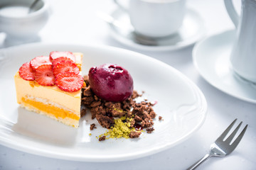 Sea ​​buckthorn cake with fruit sorbet, strawberries