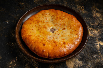 khachapuri with cheese on black background