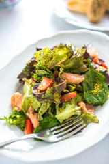 Cooked salmon salad with Norwegian salmon, strawberries