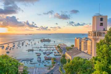 beautiful view from the Lacerda Elevator to Fort São Marcelo in Todos os Santos Bay in the city of salvador on a sunset overlooking the sea and blue sky - obrazy, fototapety, plakaty