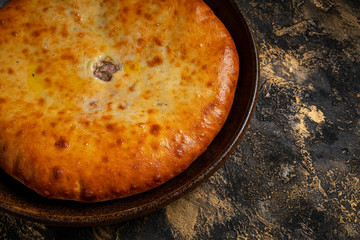 khachapuri with cheese on black background