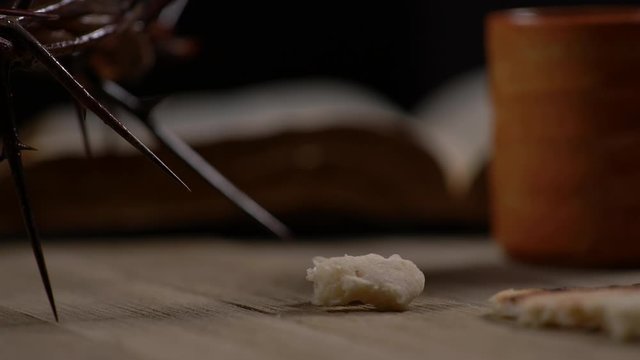 Small pieces of bread being placed on table