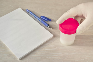 Sperm donation. A jar of tests. The doctor's desk.