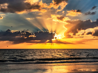 sunset over the sea, sunset, sea, sun, sky, ocean, beach, clouds, sunbeam, dramatic, wave, intense
