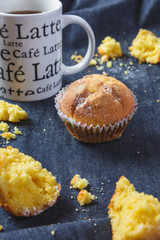 Muffins with coffee on dark background