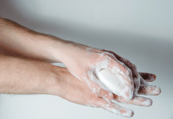 Washing hands with soap. Medical and pharmaceutical concept. Protection against viruses, bacteria, germs. Washing hands with antibacterial soap, getting rid of dirt, fighting an epidemic.