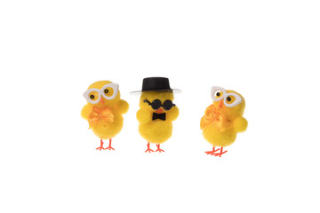 Group of decorative small easter chickens with glasses, isolated on white background.