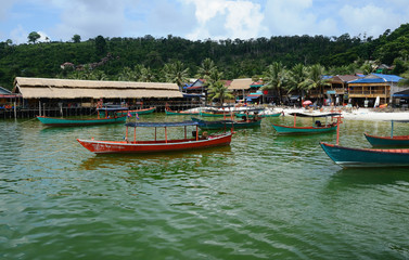 Village view with traditional khmer boats on the beach of Koh Rong Island near Sihanoukville, Gulf of Thailand, Cambodia
