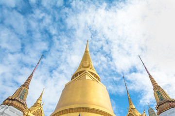 buddhist temple in bangkok with monks and colorful details in southeast asia thailand