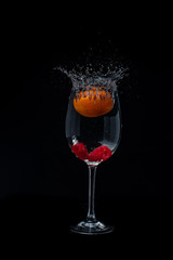 Fruits splashing in to the water