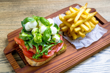 Mozzarella cheese sandwich toast and green lettuce