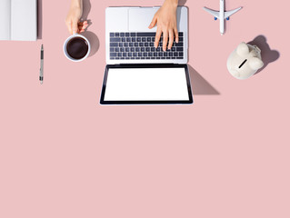 Flights online booking and reservation theme with person using a laptop computer