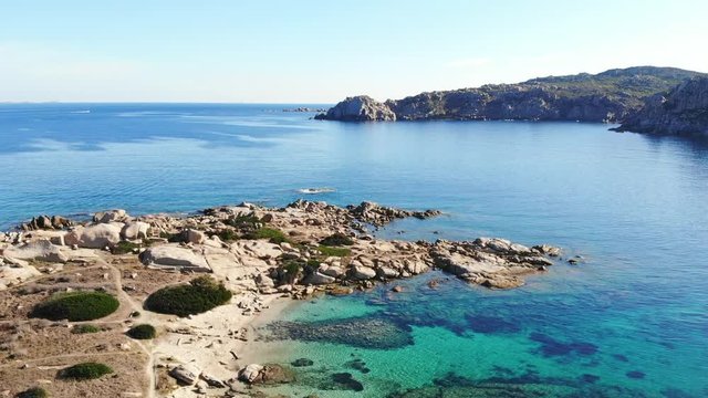 paradisiacal beach with transparent emerald turquoise water, flown by drone