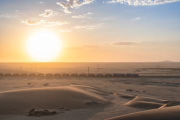 Train at sunrise in namibia desert
