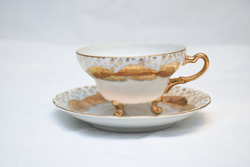Mock up / design set of elegant and traditional teapot colorful white blue gold coffee cup & Tea cup on cup's plate beside the hot tea pot , design/ drink-ware isolated on white background