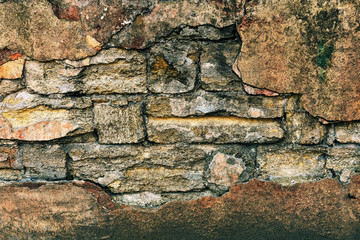 texture of an old brick wall with peeling paint
